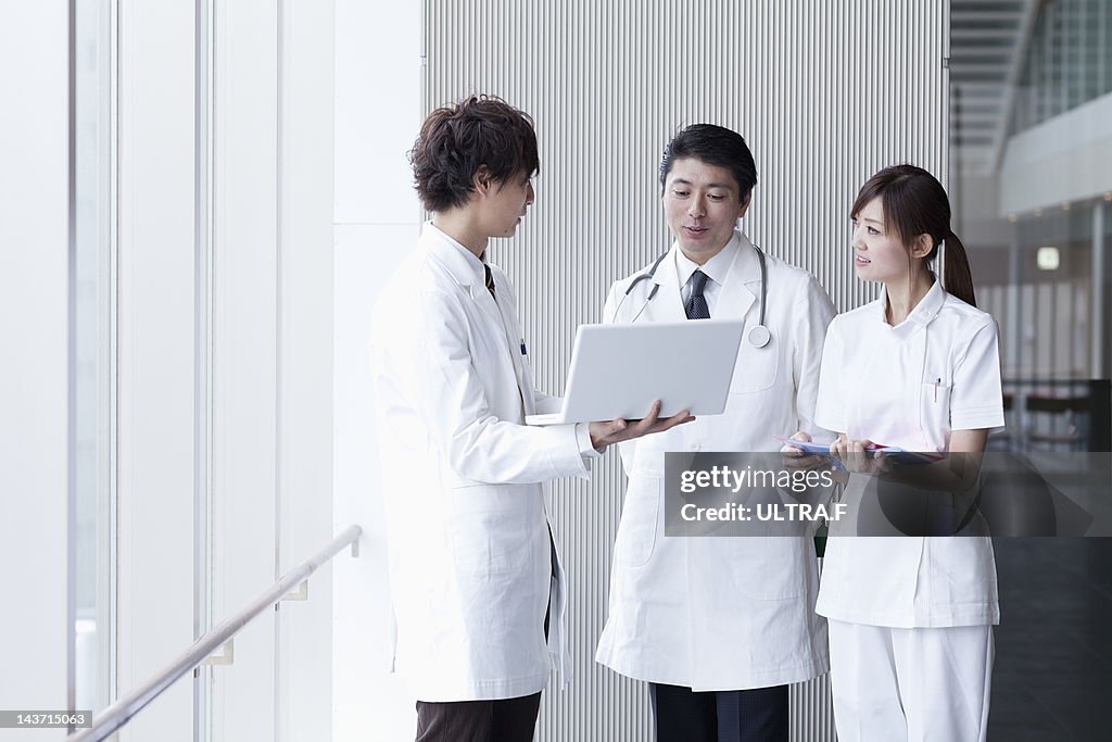 Doctors and nurse talking