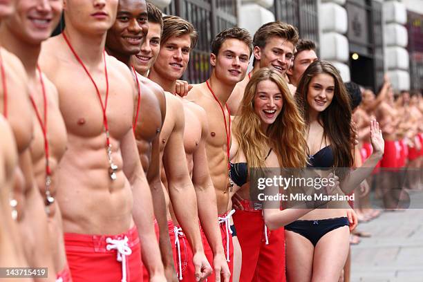 Hot Life guards pose for the opening of the Gilly Hicks and Hollister store on May 3, 2012 in London, England.