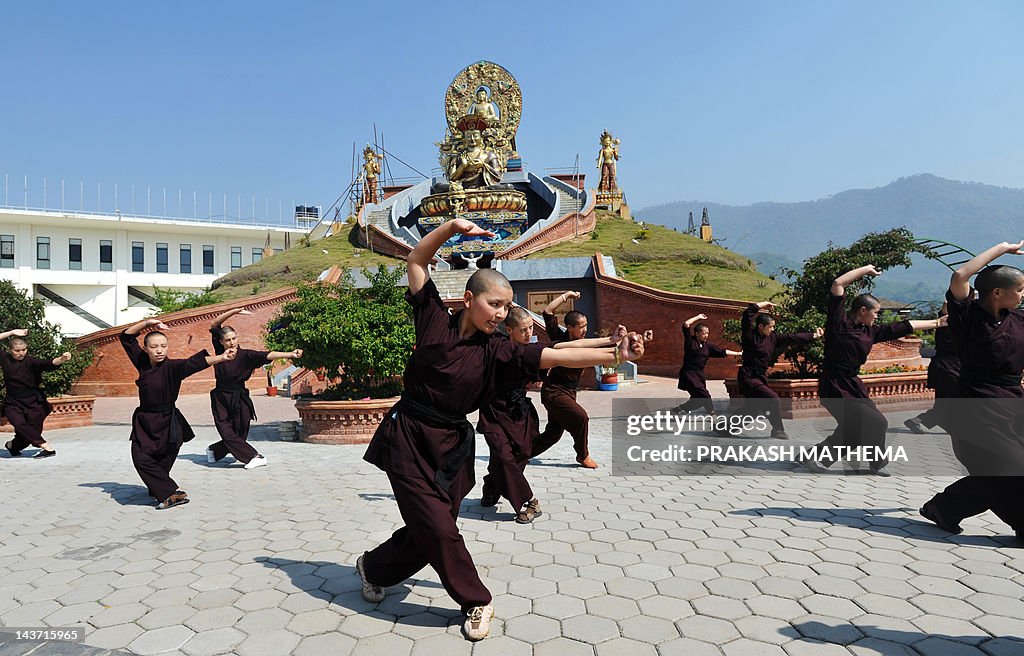 Buddhist nuns practise Kung-fu at the Am