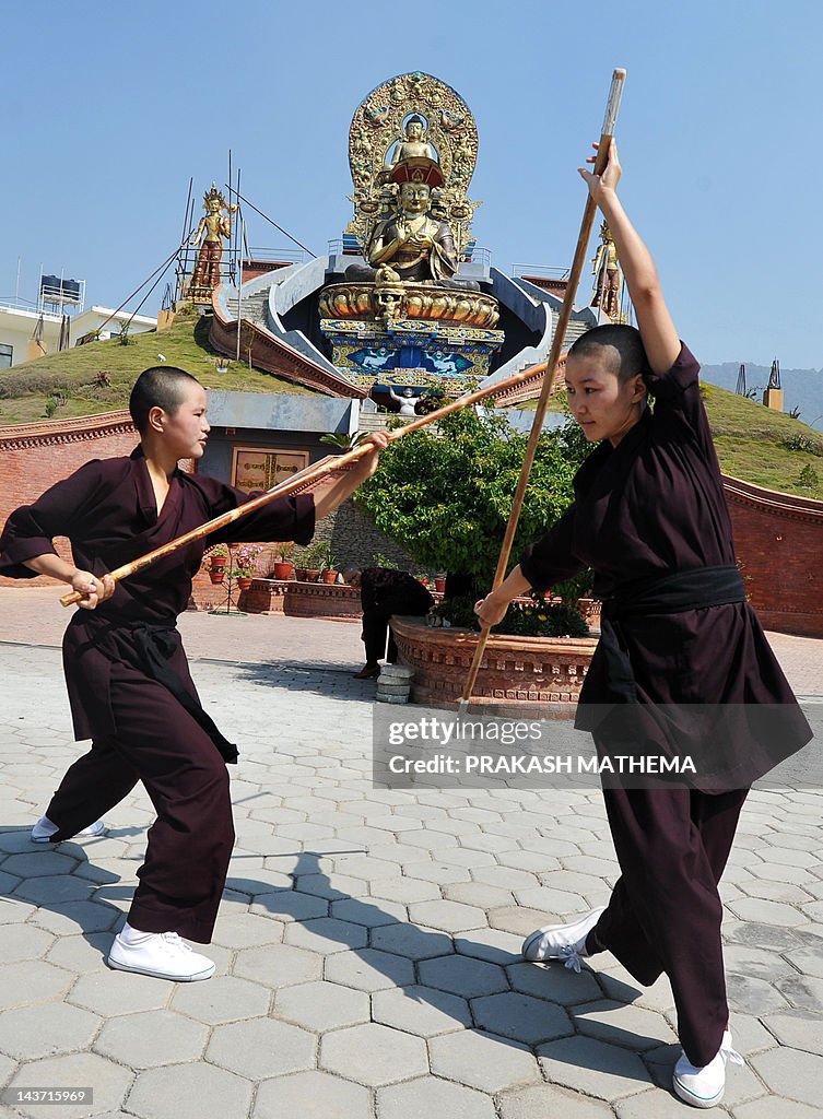 Buddhist nuns practise Kung-fu at the Am