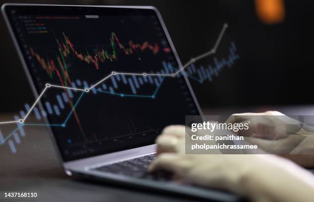 Hand Typing On Notebook Keyboard With Graph On Screen High-Res Stock ...