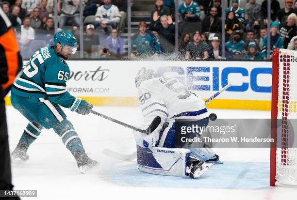 Erik Karlsson of the San Jose Sharks scores the winning goal in overtime past goalie Erik Kallgren of the Toronto Maple Leafs at SAP Center on...