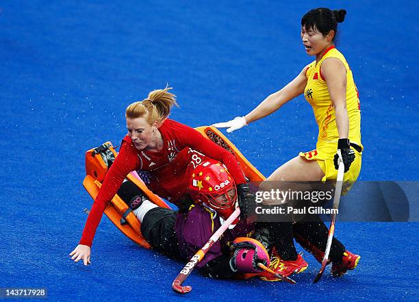 Nic White of Great Britain clashes with Yimeng Zhang and Sinan Sun of China during the Women's preliminary match between Great Britain and China...