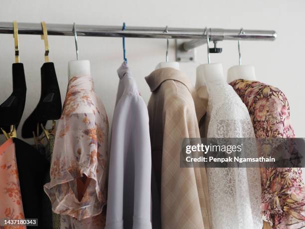 white lace fabric,  shirt women with hanger - clothing racks stock pictures, royalty-free photos & images