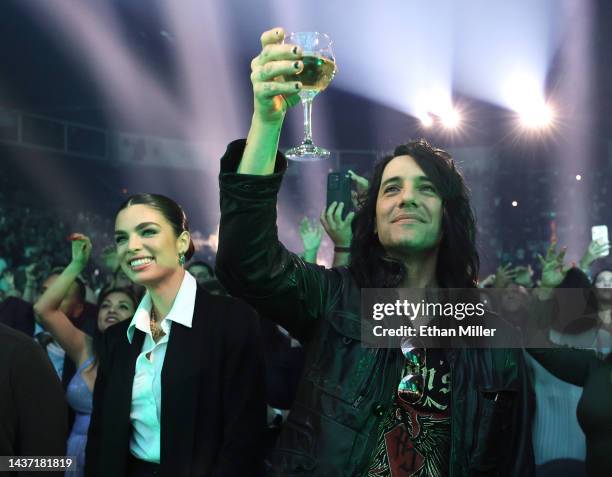 Model Nadia Ferreira and illusionist Criss Angel attend a concert by Ferreira's fiance Marc Anthony during the kickoff of his Viviendo tour at...