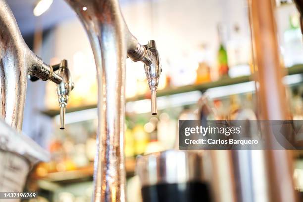 empty space photo of a draught beer pourer. - steel bar stock-fotos und bilder