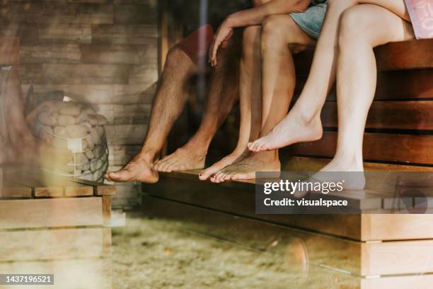 friends taking time off at backyard sauna - scandinavia stock pictures, royalty-free photos & images