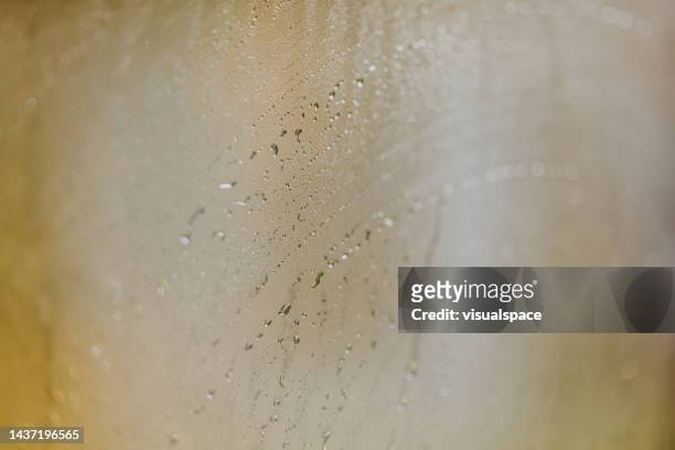 steamy water drops on sauna spa window - sauna stock pictures, royalty-free photos & images