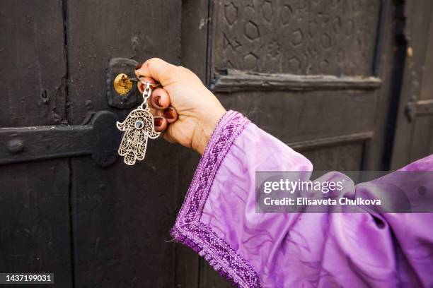 woman with hamsa symbol, morocco, africa - hamsa amulet stock pictures, royalty-free photos & images