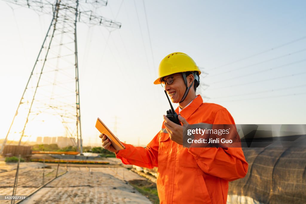 Power Protection Engineer Power Engineer Using Tablet At Sunset High-Res Stock Photo - Getty Images