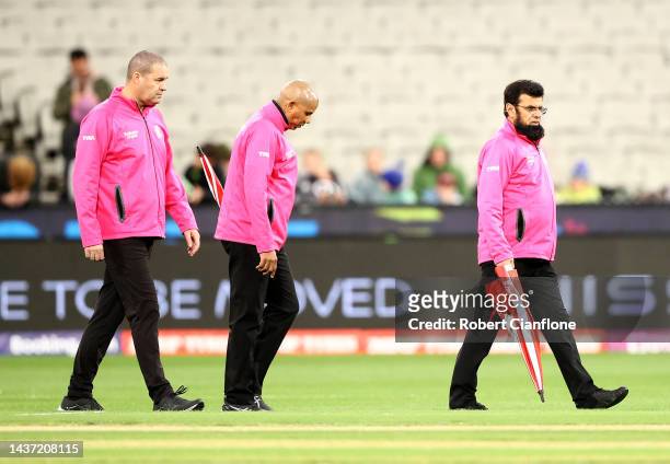 The umpires inspect the field prior to the ICC Men's T20 World Cup match between England and Australia at Melbourne Cricket Ground on October 28,...