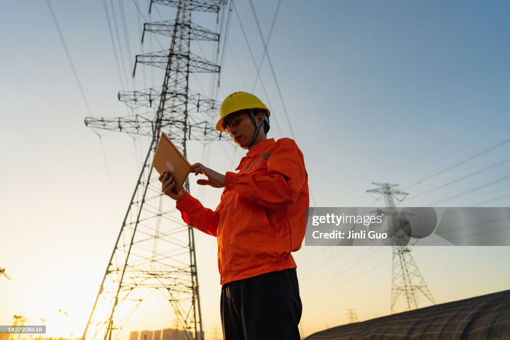 Basic Power Engineering Power Engineer Using Tablet At Sunset High-Res Stock Photo - Getty Images