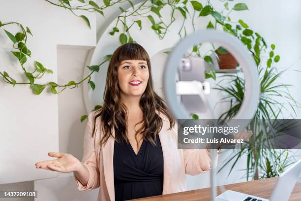 woman business influencer making a video blog for her social media channel - ring light stock pictures, royalty-free photos & images