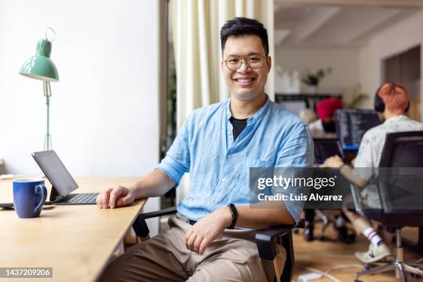 asian businessman working at startup office - data scientist stock pictures, royalty-free photos & images