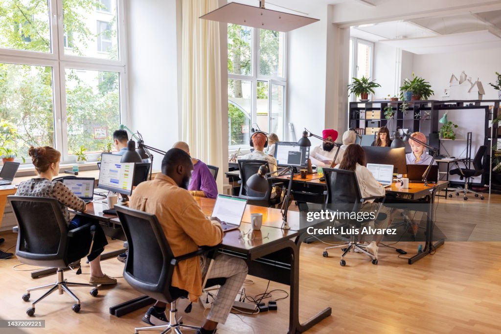 Creative business team working in an open plan office