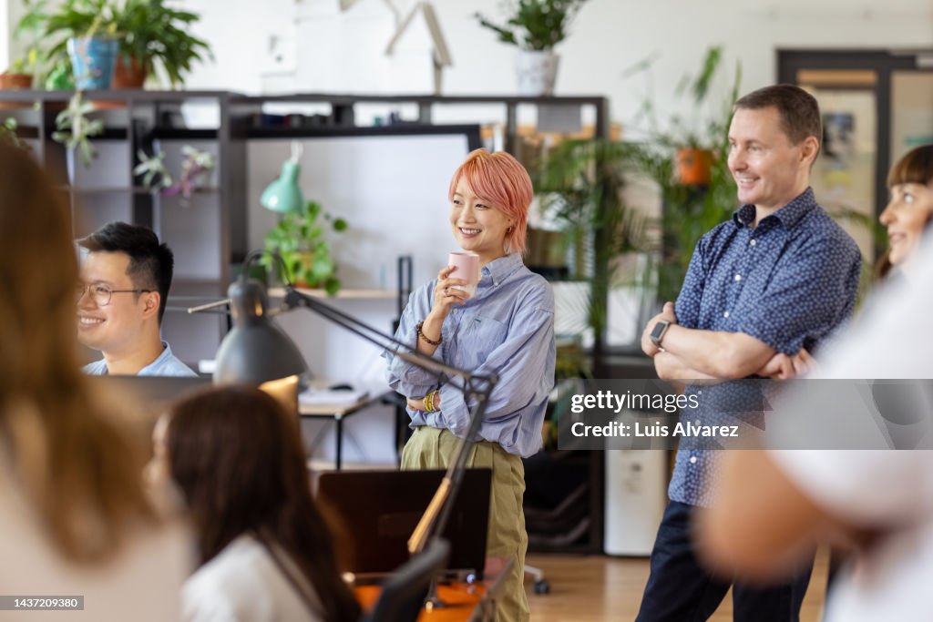 Multiracial colleagues at meeting in coworking office