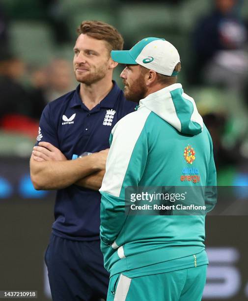 Matthew Wade of Australia speaks with Aaron Finch as rain delays play the ICC Men's T20 World Cup match between England and Australia at Melbourne...