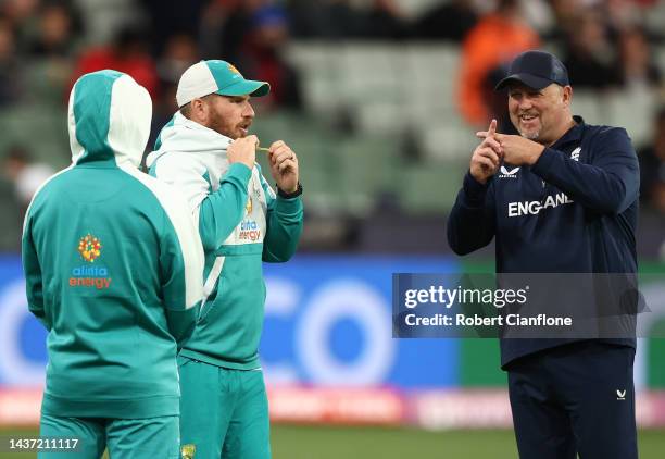 England bowling coach David Saker reacts to Matthew Wade of Australia as he speaks with Aaron Finch as rain delays play the ICC Men's T20 World Cup...