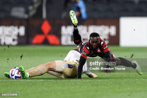 Adama Traore of the Wanderers competes with Trent Buhagiar of the Jets during the round four A-League Men's match between Western Sydney Wanderers...