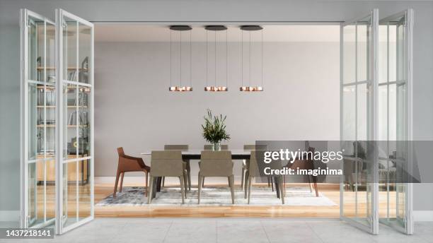 modern open plan living room with folding door entrance - eetkamer stockfoto's en -beelden