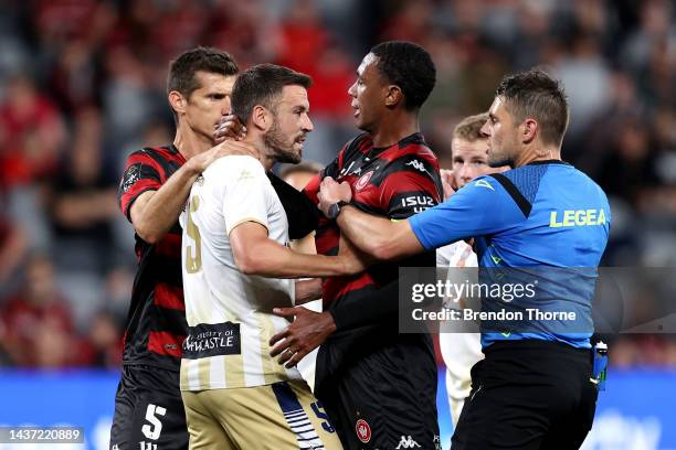 Matthew Jurman of the Jets and Marcelo of the Wanderers scuffle during the round four A-League Men's match between Western Sydney Wanderers and...