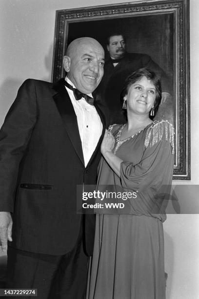 Telly Savalas and Julie Hovland attend an event at the White House in Washington, D.C., on September 10, 1985.