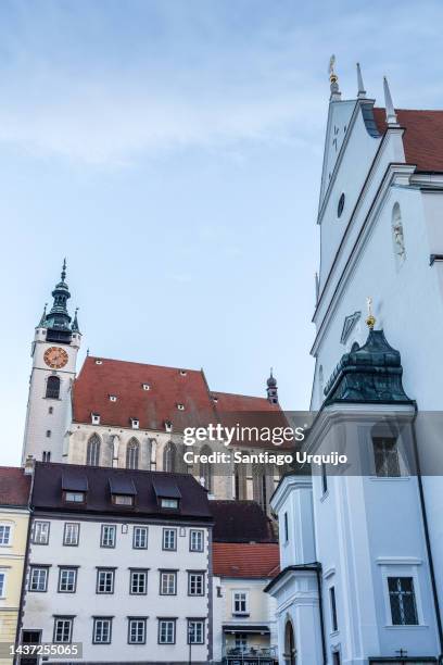 st veit and piarist churches in city of krems - krems austria stock pictures, royalty-free photos & images