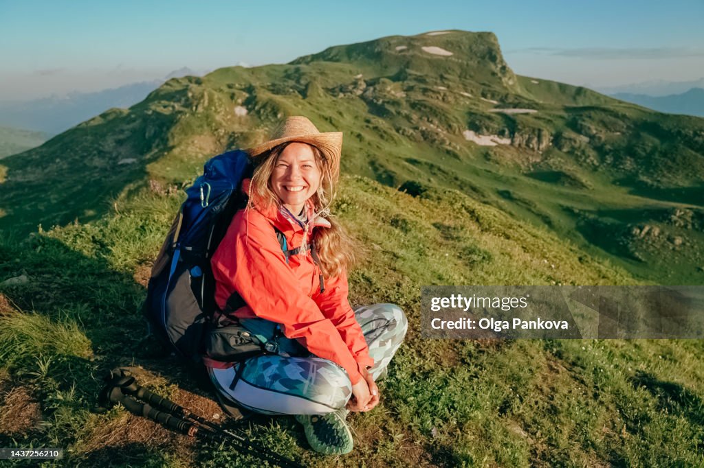 Female hiker enjoys picturesque mountain view