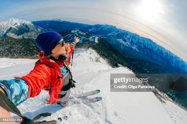 selfie of female skier in the mountains. - snowboard stock pictures, royalty-free photos & images