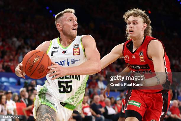 Mitchell Creek of the Phoenix drives to the basket against Luke Travers of the Wildcats during the round five NBL match between Perth Wildcats and...