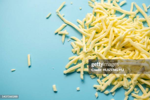 shredded cheese - cheddar cheese stock pictures, royalty-free photos & images