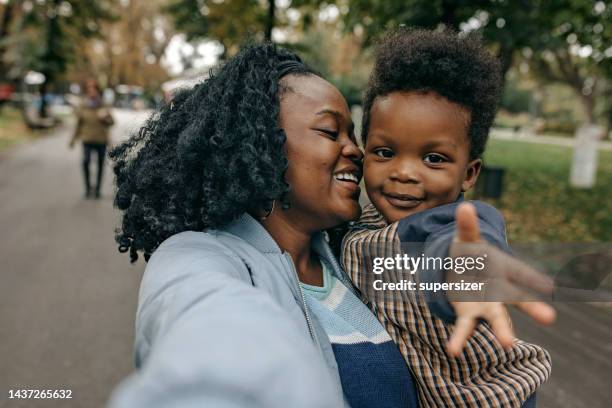 precious time together - african american single mother stock pictures, royalty-free photos & images