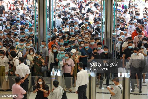 People line up to enter Haikou International Duty Free City Complex on the opening day on October 28, 2022 in Haikou, Hainan Province of China.