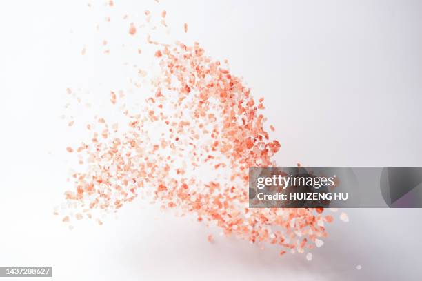 flying himalayan pink rock salt crystals - rock salt stockfoto's en -beelden