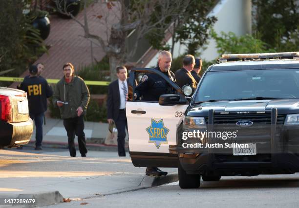 San Francisco police officers and F.B.I. Agents gather in front of the home of U.S. Speaker of the House Nancy Pelosi on October 28, 2022 in San...