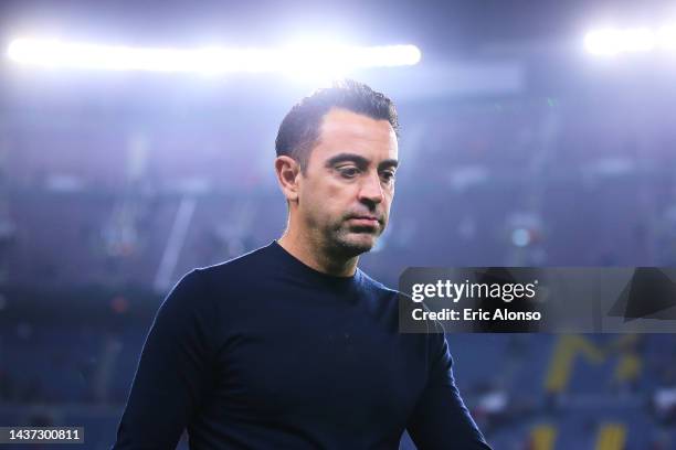 Xavi Hernandez, head coach of FC Barcelona looks dejected following their side's defeat and elimination from the UEFA Champions League in the UEFA...