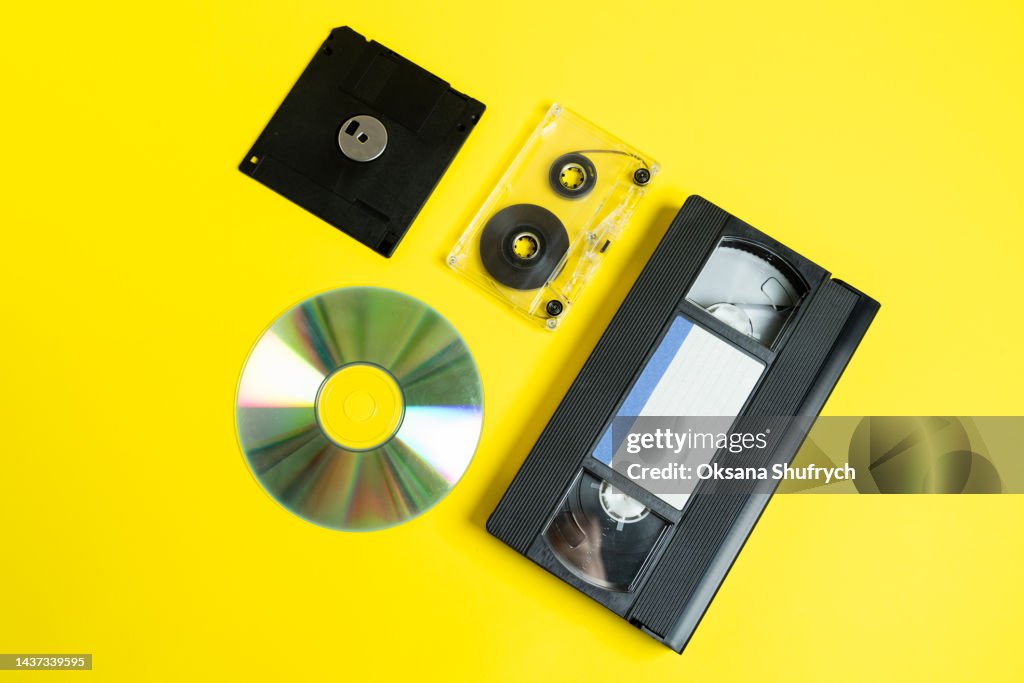 Retro analog audio and video tapes, diskette and disс