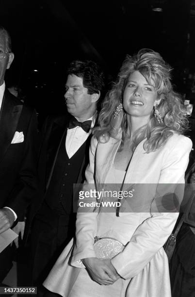 Fawn Hall and guest attend an event at the flagship Bloomingdale's store in New York City on April 6, 1988.