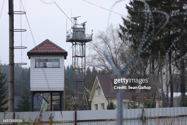 Observation towers stand behind barbed wire on the Russian side of the border between the Russian semi-exclave of Kaliningrad and Lithuania as seen...