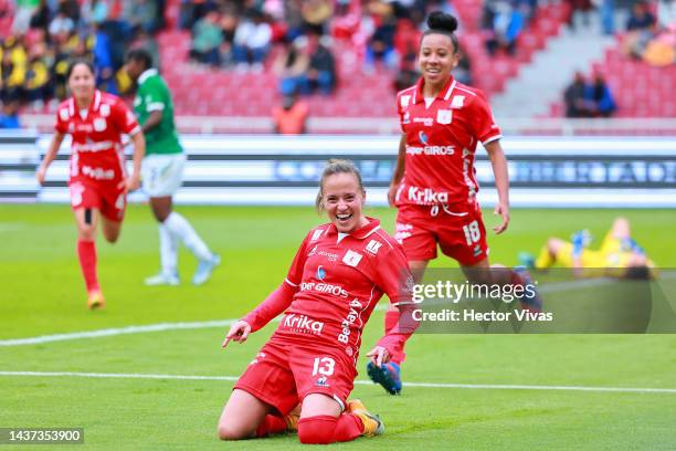 Maria Fernanda Agudelo of America de Cali celebrates with teammates after scoring their team's fourth goal during the third place match of Women's...