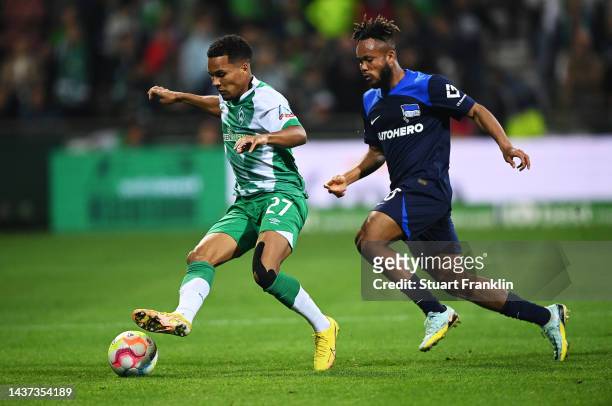 Felix Agu of SV Werder Bremenis challenged by Chidera Ejuke of Hertha BSC during the Bundesliga match between SV Werder Bremen and Hertha BSC at...