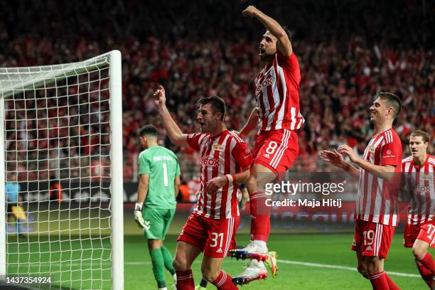 Robin Knoche of 1.FC Union Berlin celebrates with teammates after scoring their team's first goal from the penalty spot during the UEFA Europa League...