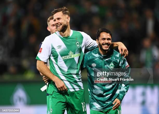 Niclas Fuellkrug of SV Werder Bremen and Leonardo Bittencourt of SV Werder Bremen celebrate after the Bundesliga match between SV Werder Bremen and...