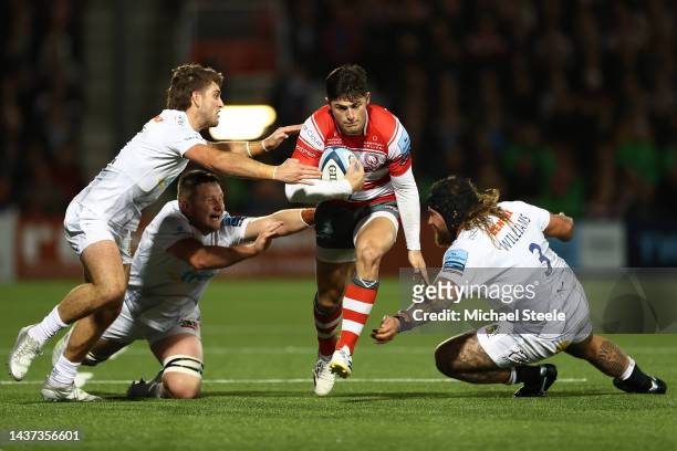 Louis Rees-Zammit of Gloucester cuts between Dan John and Harry Williams of Exeter during the Gallagher Premiership Rugby match between Gloucester...