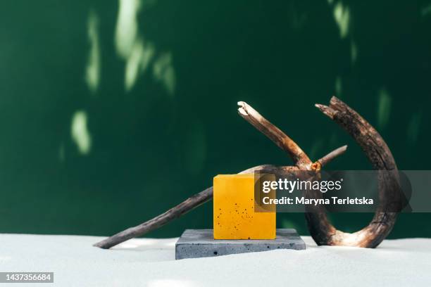 podium made of concrete on the sand. universal background. conceptual natural eco background. mocap background. - podium mode stock-fotos und bilder