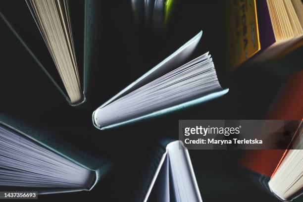 lots of books on a green background. knowledge. education. back to school. - stampare foto e immagini stock