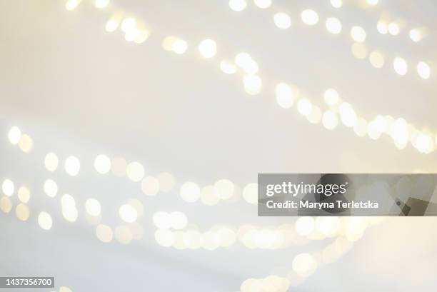 blurred abstract background with lights. christmas. new year. - glowing letters stock pictures, royalty-free photos & images