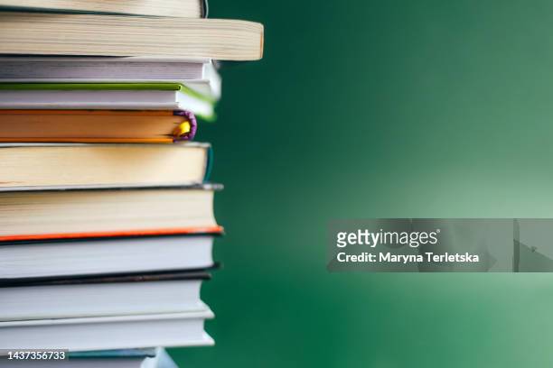 lots of books on a green background. knowledge. education. back to school. - dictionary page stock pictures, royalty-free photos & images