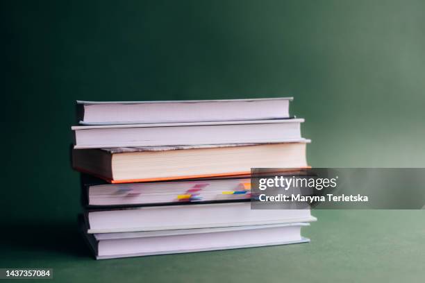 lots of books on a green background. knowledge. education. back to school. - law books fotografías e imágenes de stock