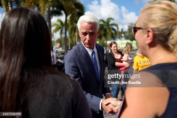 Charlie Crist, the Democratic gubernatorial candidate for Florida, greets people outside the African American Research Library and Cultural Center on...